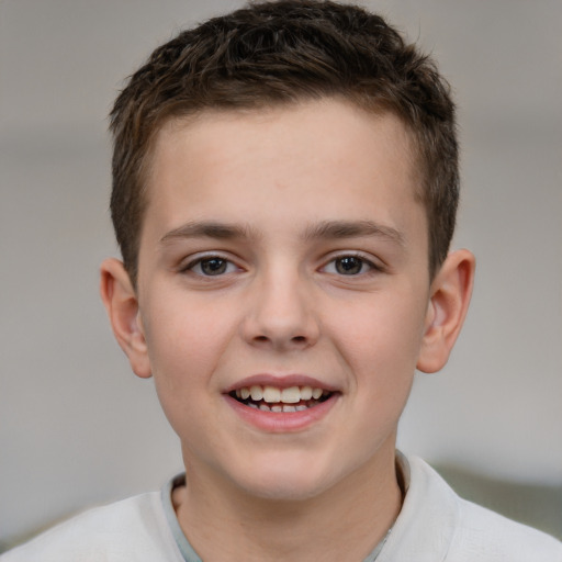 Joyful white child male with short  brown hair and brown eyes