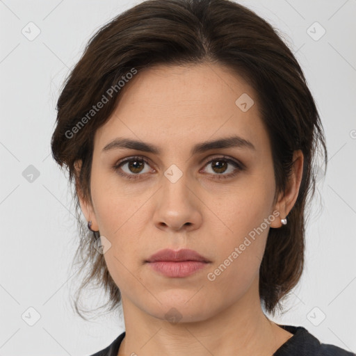 Neutral white young-adult female with medium  brown hair and brown eyes