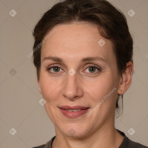 Joyful white adult female with medium  brown hair and grey eyes