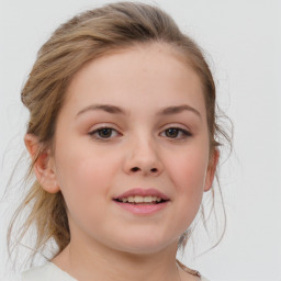 Joyful white child female with medium  brown hair and grey eyes