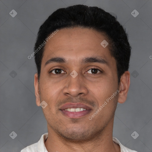 Joyful latino young-adult male with short  black hair and brown eyes