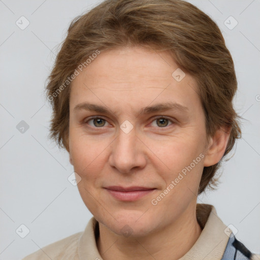 Joyful white adult female with short  brown hair and grey eyes