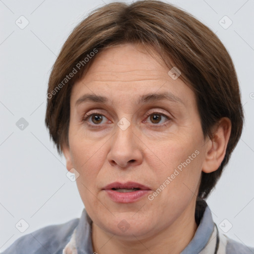 Joyful white adult female with short  brown hair and brown eyes