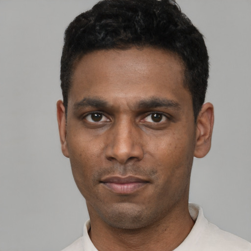 Neutral black young-adult male with short  black hair and brown eyes
