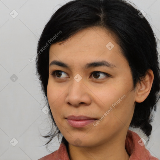 Joyful asian young-adult female with medium  black hair and brown eyes