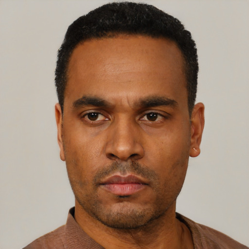 Neutral black young-adult male with short  black hair and brown eyes