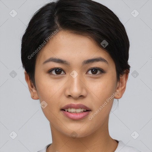 Joyful asian young-adult female with short  black hair and brown eyes