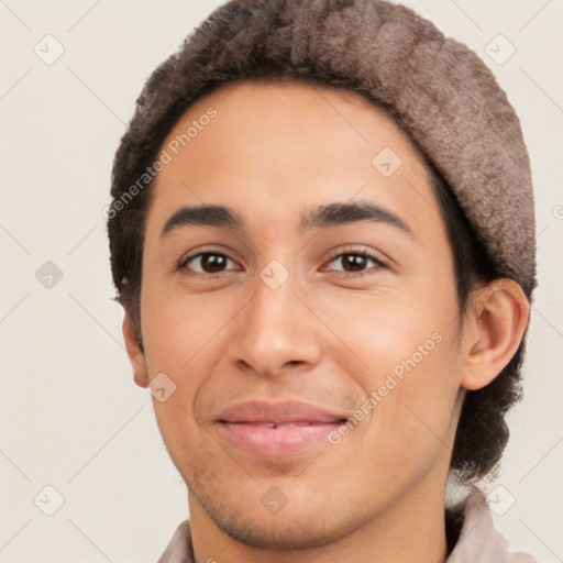 Joyful latino young-adult male with short  brown hair and brown eyes