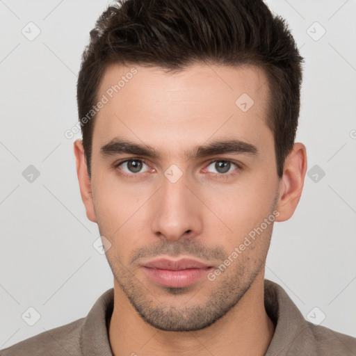 Neutral white young-adult male with short  brown hair and brown eyes