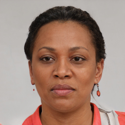 Neutral latino adult female with short  black hair and brown eyes