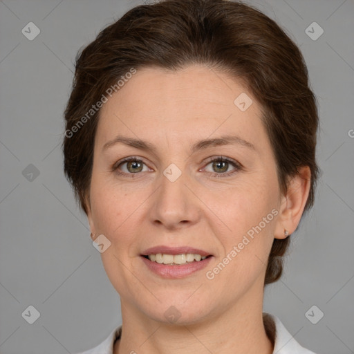 Joyful white adult female with medium  brown hair and grey eyes