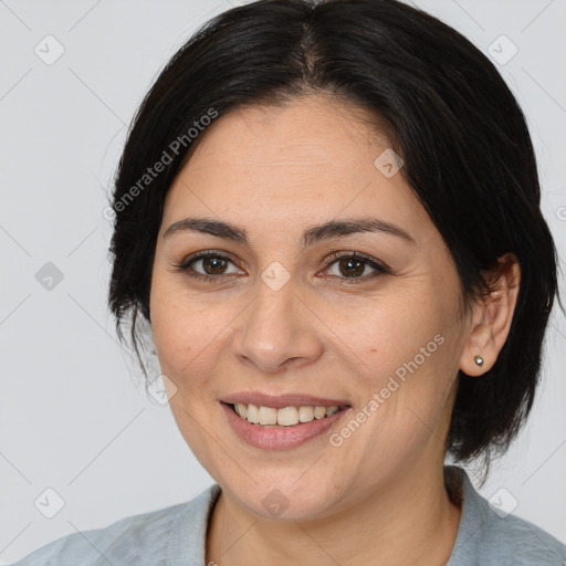 Joyful white adult female with medium  brown hair and brown eyes