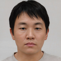 Neutral asian young-adult male with short  brown hair and brown eyes