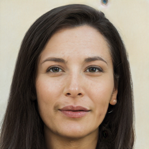 Joyful asian young-adult female with long  brown hair and brown eyes