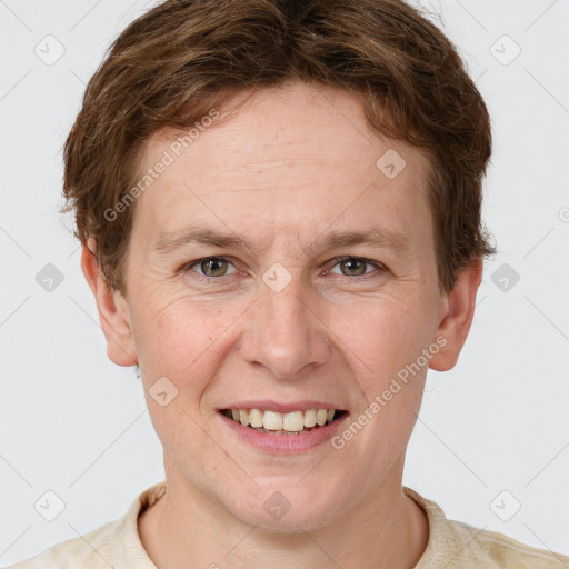 Joyful white adult male with short  brown hair and grey eyes