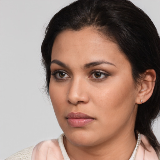Neutral latino young-adult female with medium  brown hair and brown eyes