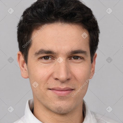 Joyful white young-adult male with short  black hair and brown eyes