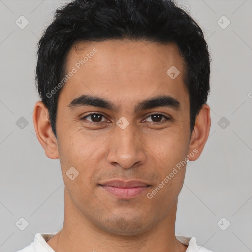 Joyful latino young-adult male with short  brown hair and brown eyes