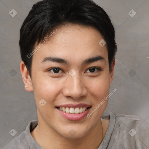 Joyful asian young-adult male with short  brown hair and brown eyes