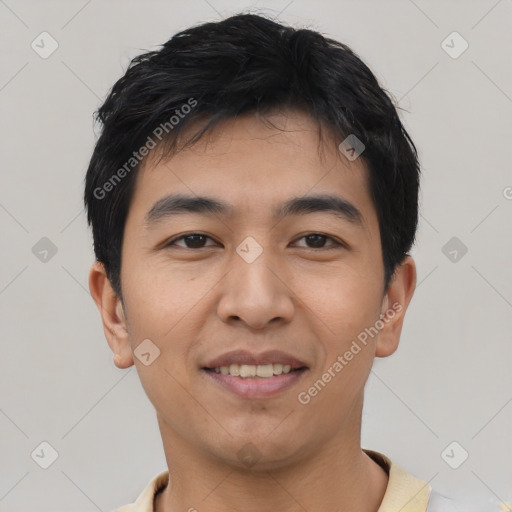 Joyful asian young-adult male with short  black hair and brown eyes