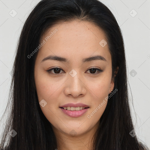 Joyful asian young-adult female with long  brown hair and brown eyes