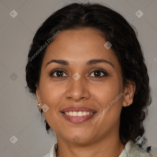 Joyful latino adult female with medium  brown hair and brown eyes