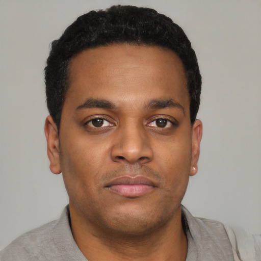 Neutral black young-adult male with short  black hair and brown eyes