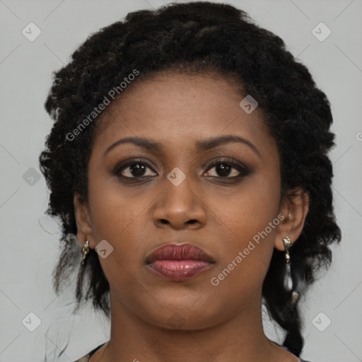 Joyful black young-adult female with medium  black hair and brown eyes
