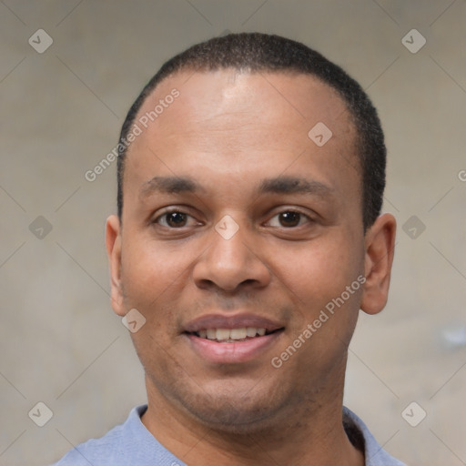 Joyful black young-adult male with short  black hair and brown eyes