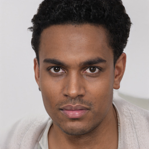 Neutral black young-adult male with short  black hair and brown eyes