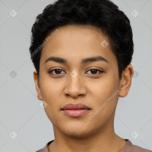 Joyful latino young-adult female with short  black hair and brown eyes