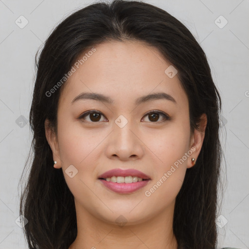 Joyful asian young-adult female with long  brown hair and brown eyes