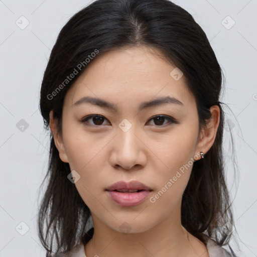 Joyful asian young-adult female with medium  brown hair and brown eyes