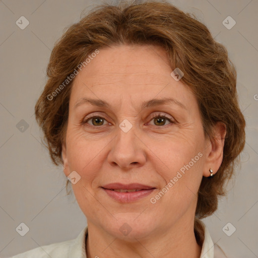 Joyful white adult female with medium  brown hair and green eyes