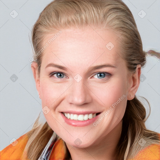 Joyful white young-adult female with medium  brown hair and blue eyes