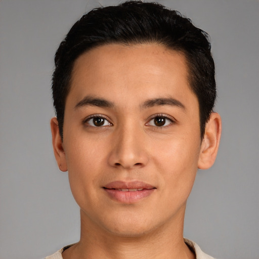 Joyful latino young-adult male with short  brown hair and brown eyes