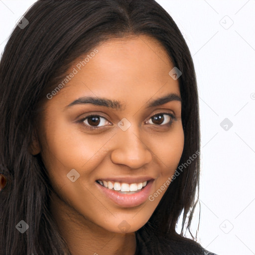 Joyful latino young-adult female with long  brown hair and brown eyes