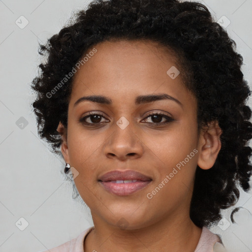 Joyful black young-adult female with long  brown hair and brown eyes