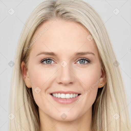 Joyful white young-adult female with long  brown hair and blue eyes