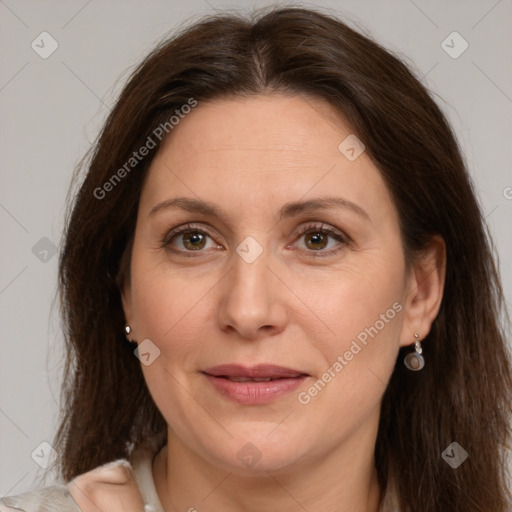 Joyful white adult female with medium  brown hair and brown eyes