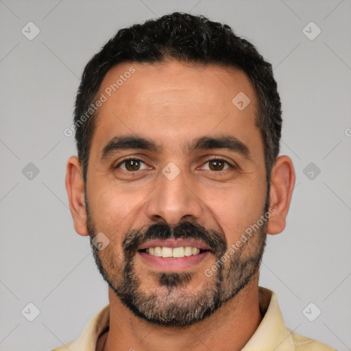 Joyful white adult male with short  black hair and brown eyes