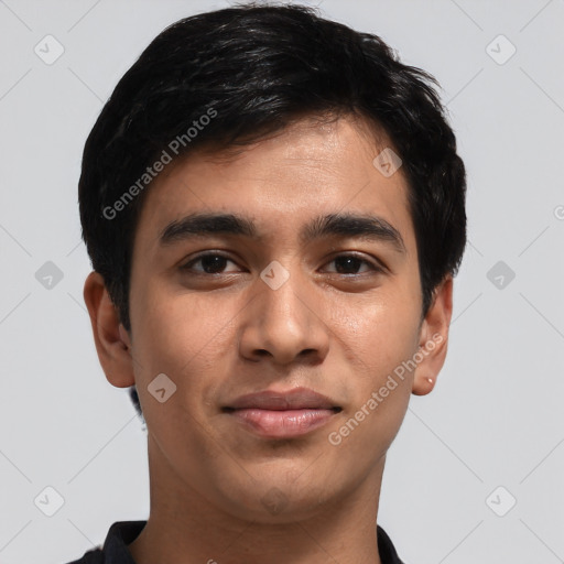 Joyful latino young-adult male with short  brown hair and brown eyes