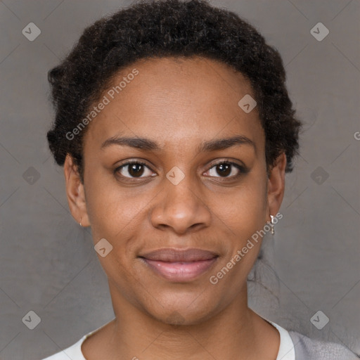 Joyful black young-adult female with short  brown hair and brown eyes