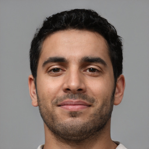 Neutral latino young-adult male with short  brown hair and brown eyes