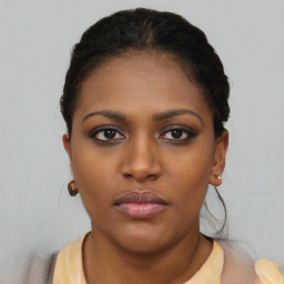 Neutral black young-adult female with short  black hair and brown eyes