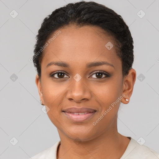 Joyful black young-adult female with short  brown hair and brown eyes