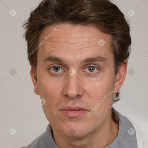 Joyful white adult male with short  brown hair and grey eyes