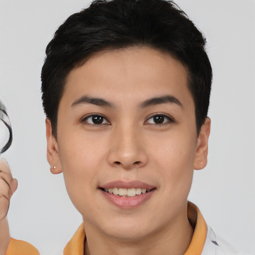 Joyful asian young-adult female with short  brown hair and brown eyes