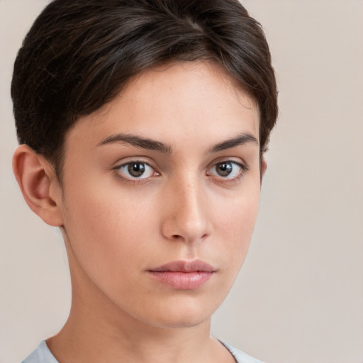 Neutral white young-adult female with short  brown hair and brown eyes