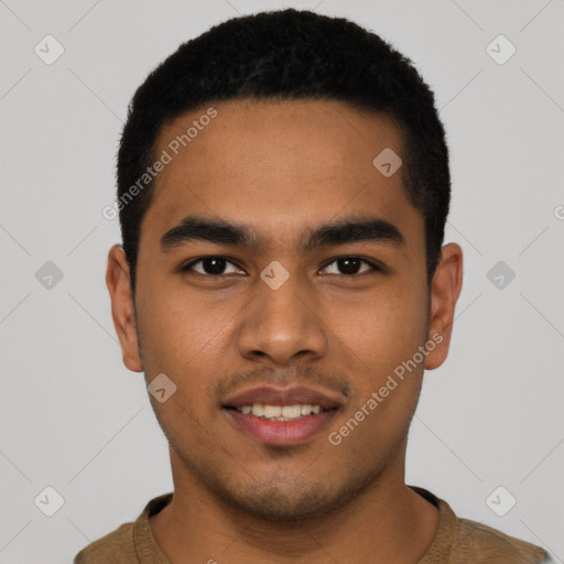 Joyful latino young-adult male with short  black hair and brown eyes